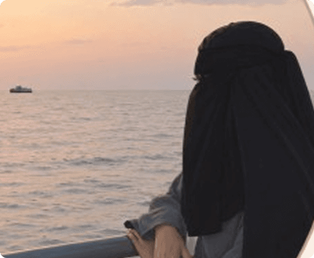 Sara looking out over the water at sunset